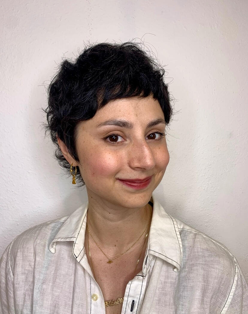 Pixie cut with length around the perimeter.